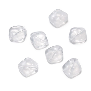 Detailed macro view of seven transparent acrylic irregular ice-shaped beads with drill holes