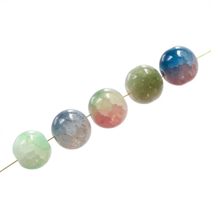 Close-up of 10mm frosted glass beads with ice-cracked texture for DIY jewelry making
