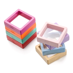 Detailed stack of colorful macaron square PE film jewelry display boxes with push button