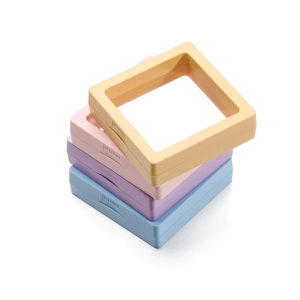 Stack of macaron-colored PE film jewelry boxes in yellow pink purple and blue