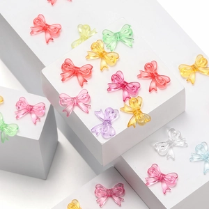 Macro shot of colorful translucent acrylic bow beads for DIY craft and jewelry