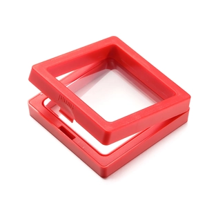 Detail of red square PE film jewelry display box showing push button and floating film