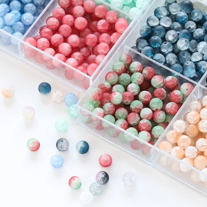 Macro detail of 10mm frosted glass beads with ice crack texture in diverse vibrant colors