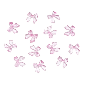 Close-up of translucent pink resin bow-knot DIY accessories for nail art decoration