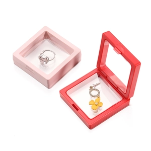 Pink and red square PE film floating display boxes showing jewelry and push button feature