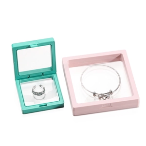 Close-up of PE film suspension jewelry boxes showing a ring and a bracelet