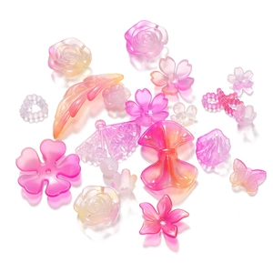 Mix van acryl kralen in bloem- en strikvorm met roze-oranje verloop voor DIY-sieraden
