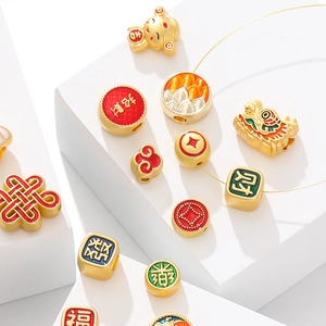 Detailed view of gold alloy auspicious beads with enamel finish for DIY jewelry crafting
