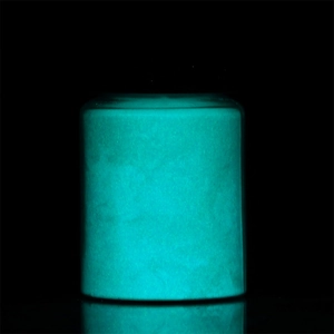 Glow-in-the-dark luminous powder in a clear jar showing vibrant cyan glow in dark