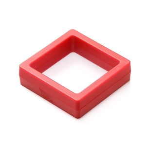 Macro shot of red PE film jewelry box showing the PUSH button and elastic membrane
