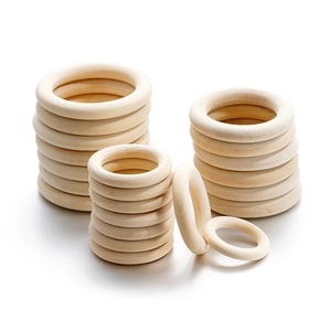 Detailed view of polished natural wooden rings in various sizes for DIY handicrafts