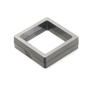 Detail view of square PE film jewelry box with push button and matte grey plastic frame