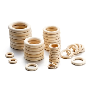 Natural wood rings in various sizes for DIY crafts and handbags on white background