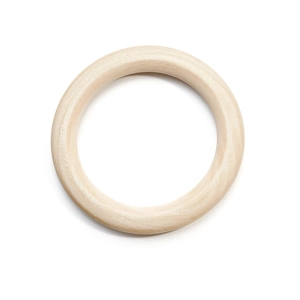 Macro shot of smooth natural wood ring for DIY crafts with visible wood grain details