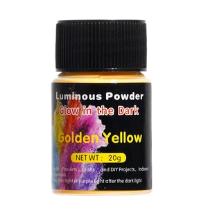 Macro shot of 20g golden yellow luminous powder in a clear jar with a black screw cap