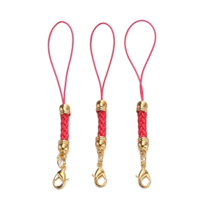 Close-up of three red braided phone lanyards with gold lobster clasps and metal cylinders