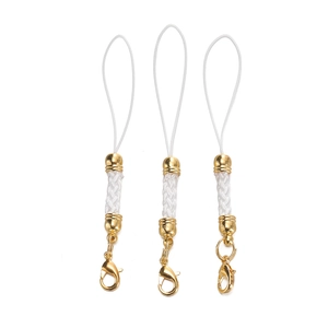 Close-up of DIY craft lanyards with white braided ropes and gold lobster clasps