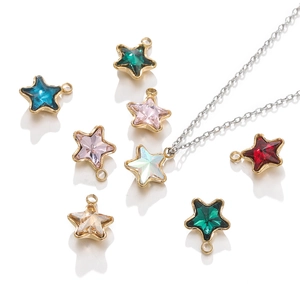 Detailed macro of colorful 18k gold plated star pendants for DIY jewelry crafting