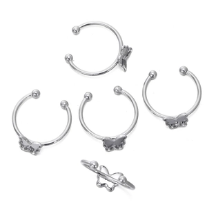 Macro detail of butterfly silver ear cuffs with S925 hallmark and polished finish