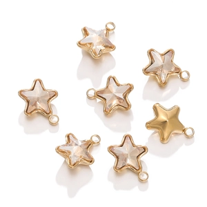 Macro shot of 18k gold plated star charms with champagne crystals for DIY jewelry making