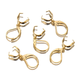 Macro detail of five gold-plated stainless steel lever back earring findings for DIY jewelry