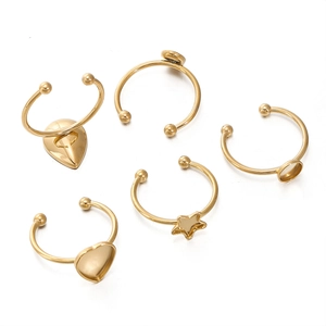 Macro view of 18k gold plated stainless steel DIY ring blanks with heart and star shapes