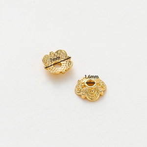 Macro detail of 7mm 18k gold plated flower bead caps for DIY jewelry making