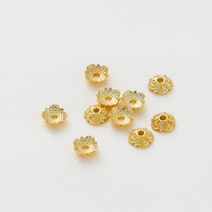 Detailed view of 18k gold plated hollow flower bead caps for DIY jewelry making