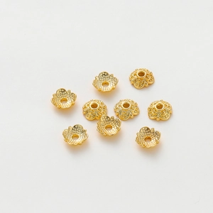 Macro shot of 18k gold plated hollow flower bead caps for DIY jewelry making