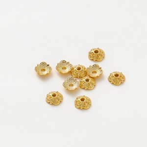 Detailed macro view of 18k gold plated flower bead caps for DIY jewelry making
