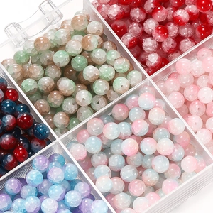 Macro view of 10mm glass beads with ice crackle texture in a transparent storage box