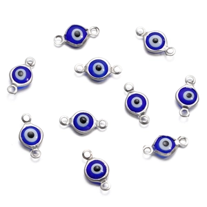 Close-up of stainless steel evil eye connectors for DIY jewelry making sets