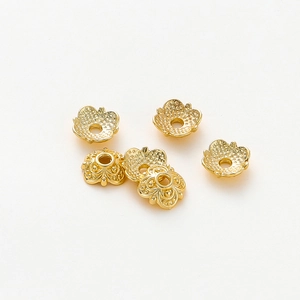 Detail view of 18k gold plated hollow flower petal bead caps for DIY jewelry making