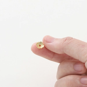 Macro detail of 18k gold plated hollow flower petal bead caps for DIY jewelry making