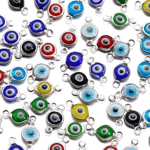 Macro shot of colorful stainless steel evil eye connectors for DIY jewelry making