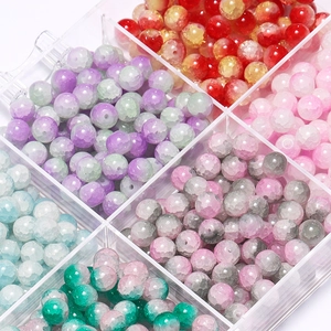 Macro shot of 10mm glass beads with ice crackle texture in a 9-grid storage box