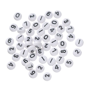 Close-up of white acrylic beads with black numbers for DIY jewelry crafting and beading