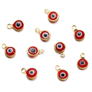 Detailed view of ten red evil eye connectors for DIY jewelry making and necklaces