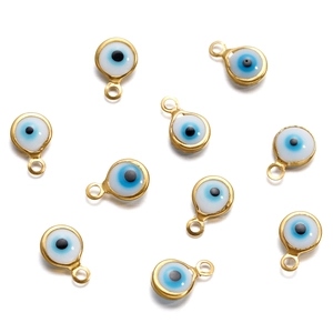 Detailed view of ten stainless steel evil eye connector pendants for DIY jewelry making