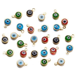 Macro shot of colorful evil eye charm connectors for DIY jewelry making accessories