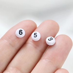 White acrylic round beads with black numbers for DIY jewelry making and crafting projects