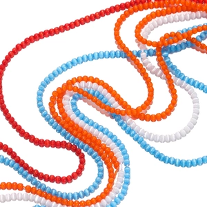 Close-up of 2mm cat-eye glass beads in red, orange, and blue for DIY jewelry crafting