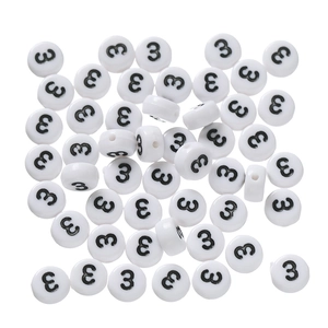 Macro view of white acrylic round beads with black number 3 for DIY jewelry making