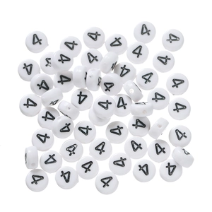 Detailed macro view of white round acrylic beads with black number 4 for DIY jewelry