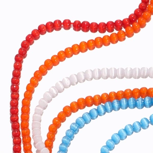 Macro shot of 2mm colorful cat eye glass beads for DIY jewelry making and crafts