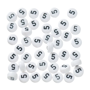 Macro shot of white acrylic beads with black number five for DIY jewelry making