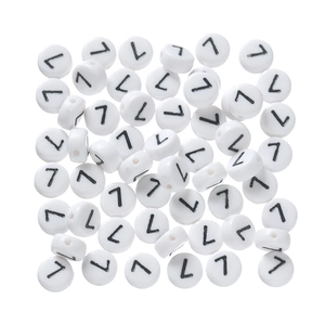 Close-up of white acrylic letter L beads with black engraving for DIY jewelry making