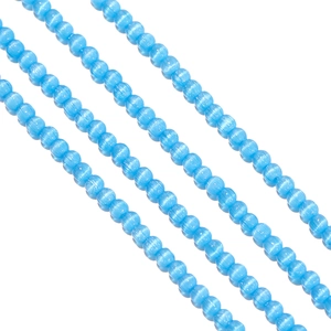 Macro view of sky blue cat eye glass beads 2mm for DIY jewelry making and beadwork