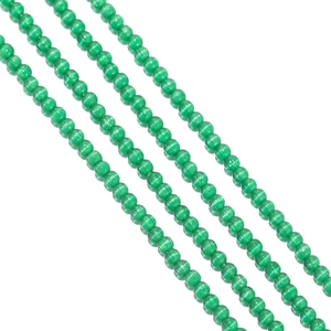 Detailed view of 2mm emerald green cat eye glass beads for DIY jewelry making