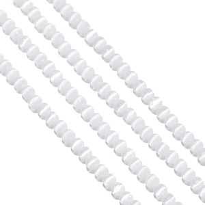 Detailed view of 2mm white cat eye glass seed beads with shimmering optical effect